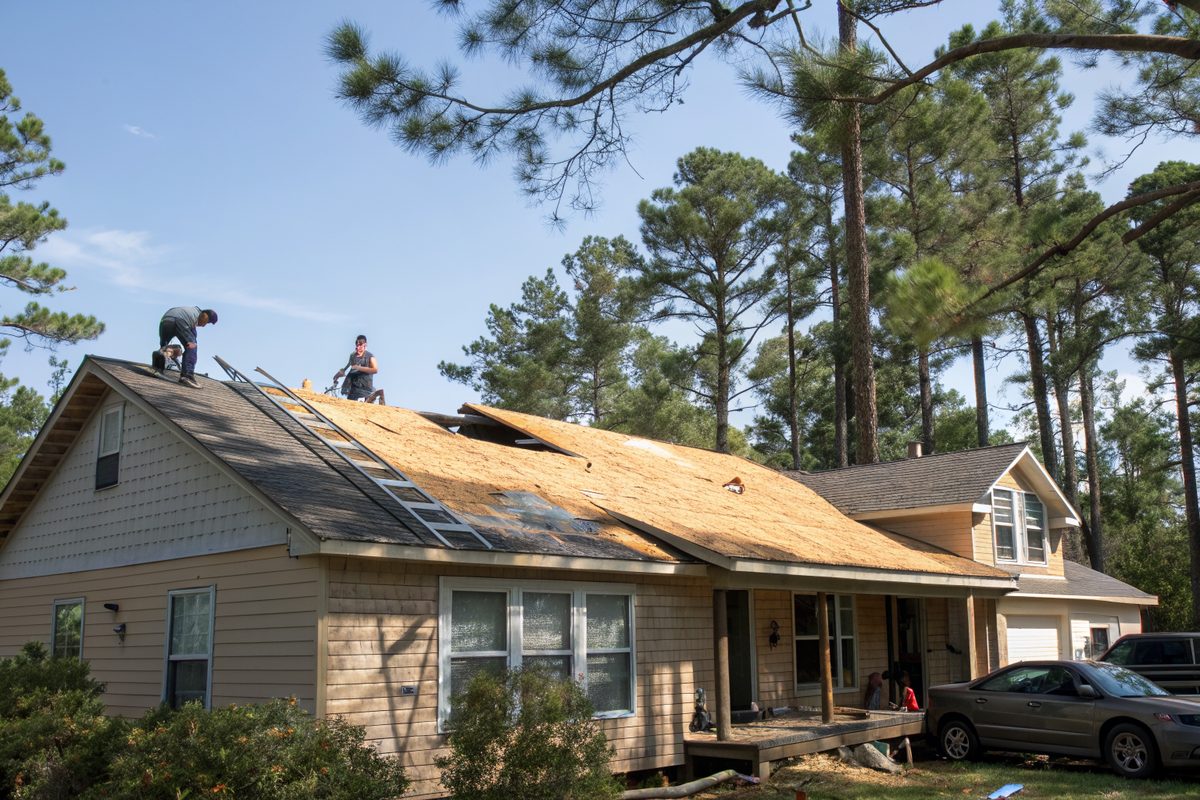 A roof stripped to plywood during a tear-off